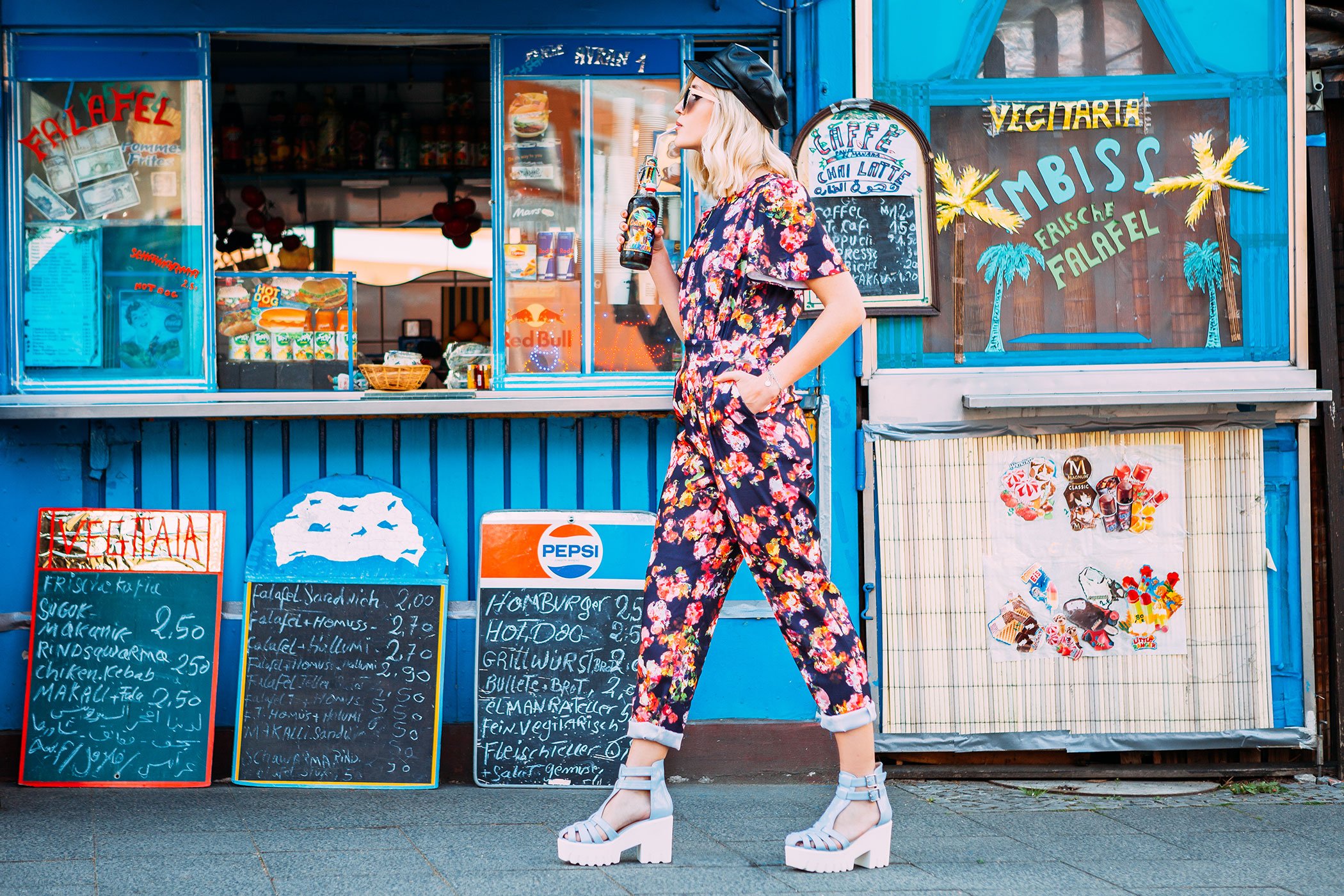 mikuta with flower jumpsuit at the kiosk